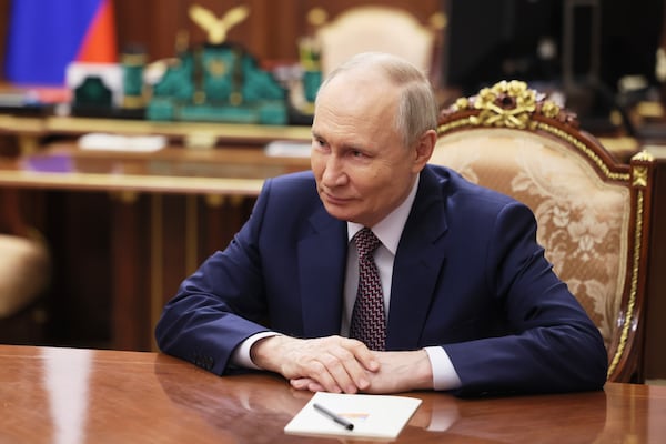 Russian President Vladimir Putin speaks with Irina Gekht, the newly appointed governor of Nenets Autonomous District, during their meeting at the Kremlin in Moscow, Russia, Tuesday, March 18, 2025. (Mikhail Metzel, Sputnik, Kremlin Pool Photo via AP)