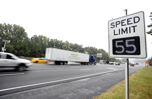 Atlanta drivers on the top end of I-285 will now have their speeds regulated by variable speed limits (VSL) signs posted along the perimeter highway as seen near Roswell Road during rush hour on Monday, Oct. 13, 2014 in Atlanta. The new electronic signs went into effect in early October and they are capable of changing speed limits to either higher or lower speeds as traffic ebbs and flows throughout the day. AJC 2014