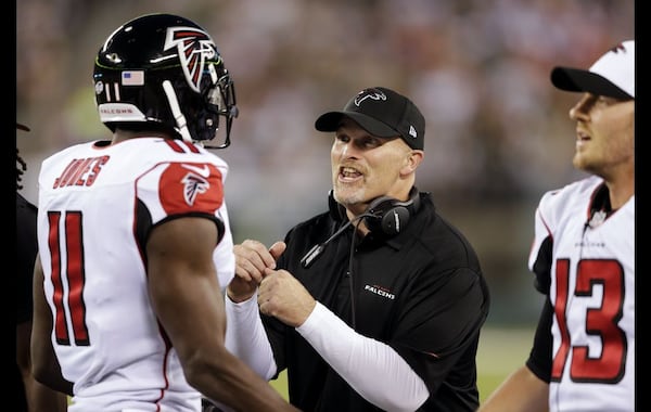 Falcons coach Dan Quinn encourages Julio Jones (11) during the first half Friday against the Jets. (AP Photo/Peter Morgan)