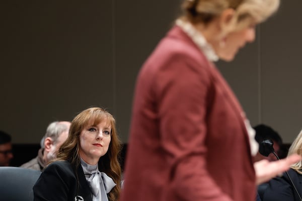 Andrea Dyer Hastings, attorney for Joycelyn Wade, wife of prosecutor Nathan Wade looks on as Ashleigh Merchant, an attorney for defendant Mike Roman speaks during a hearing to determine if a subpoena issued to Fulton County  District Attorney Fani Willis should be enforced at Cobb County Superior Court on Monday, Jan. 22, 2024. Natrice Miller/ Natrice.miller@ajc.com)