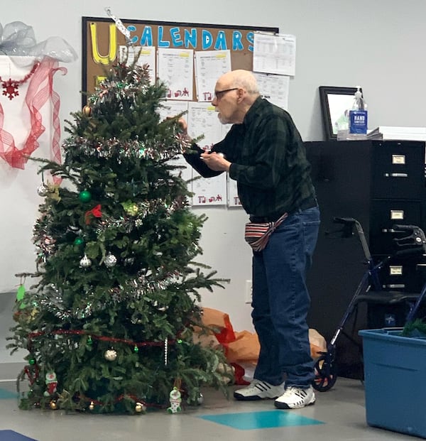 It’s time to decorate the tree for InCommunity’s annual holiday party. (Courtesy of InCommunity)