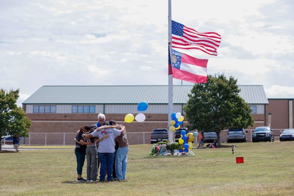 Al New from the Billy Graham rapid response team offered a prayer with the Mendoza Family from Winder, who came to pay respects to the victims at Apalachee High School on Thursday, September 5, 2024. A day after, a 14-year-old opened fire at a Barrow County high school on Wednesday morning, killing two students and two teachers and injuring nine others.
(Miguel Martinez/AJC)
