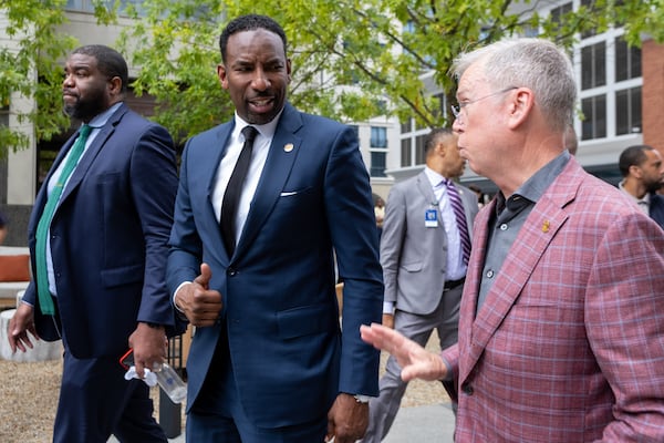 Atlanta Mayor Andre Dickens talks with Jim Durrett, president and CEO of the Buckhead Coalition and executive director of the Buckhead CID. Ben Gray for the Atlanta Journal-Constitution