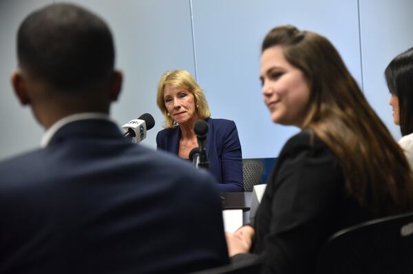 U.S. Secretary of Education Betsy DeVos listens to students during a tour of Georgia State University in November 2017. During that visit DeVos talked about a mobile app for students to apply for federal financial aid and other ways to streamline the financial-aid process. HYOSUB SHIN / HSHIN@AJC.COM