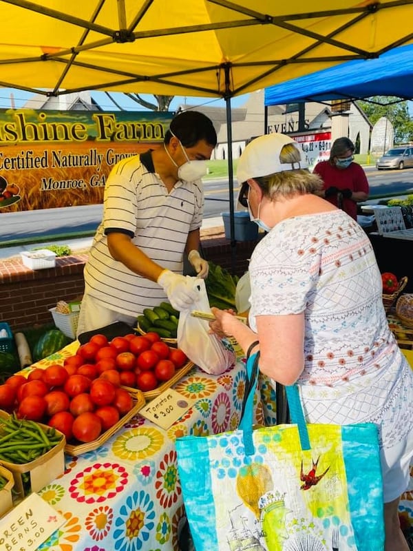 Aldo Ramos is one of the many farmers who sells at the Snellville Farmers Market. Masks and gloves are part of the COVID precautions there.
Courtesy of Gretchen Schultz