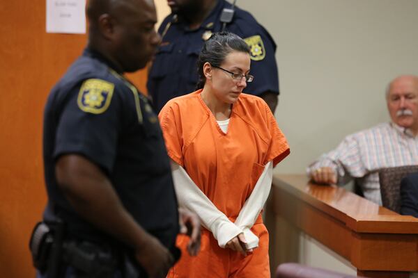 Victoria Rickman (entering courtroom) was denied bond by Judge Courtney L. Johnson during a 2013 hearing in DeKalb County Superior Court in Decatur.