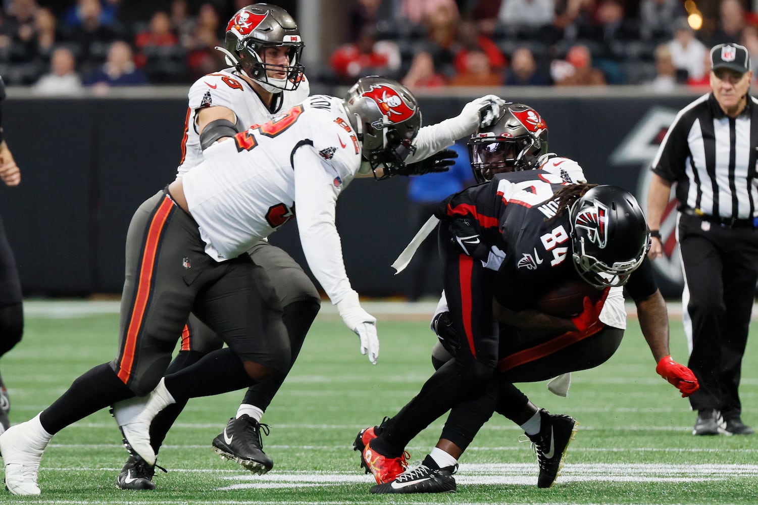 Falcons running back Cordarrelle Patterson gets tackled by Buccaneers defenders during the second quarter Sunday in Atlanta. (Miguel Martinez / miguel.martinezjimenez@ajc.com)