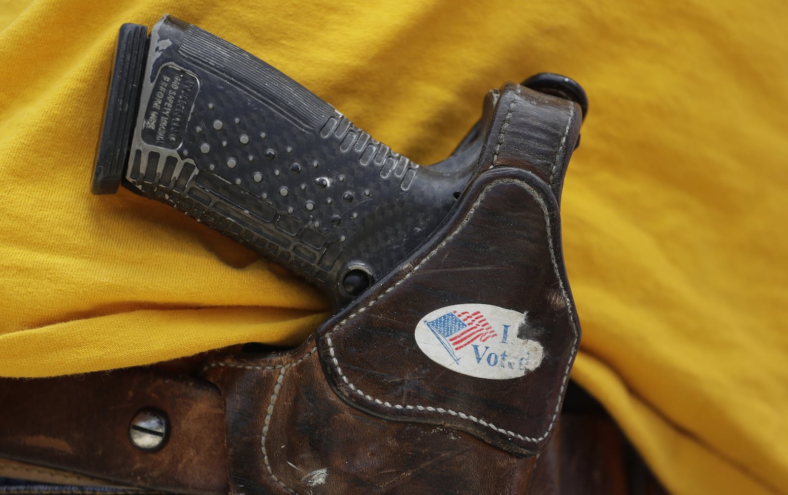 A man wears an unloaded pistol during a 2018 gun-rights rally in Austin, Texas. (Eric Gay / AP file photo)