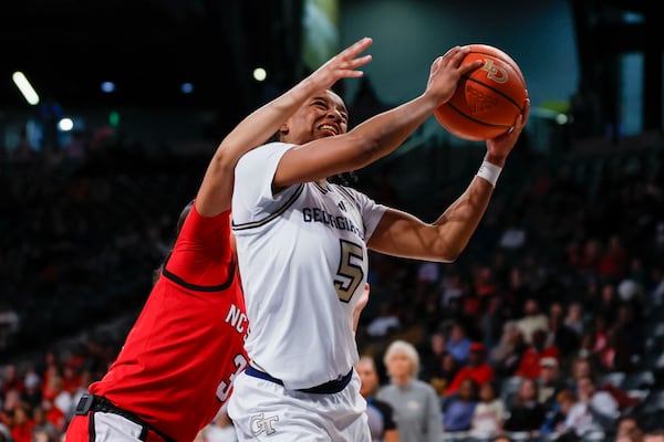 Georgia Tech Yellow Jackets guard Tonie Morgan (5) gets fouled from behind during the second half against NC State Wolfpack at McCamish Pavilion on Thursday, February 20, 2025, in Atlanta.
(Miguel Martinez/ AJC)