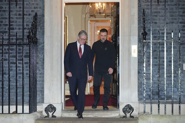 Britain's Prime Minister Keir Starmer, escorts Ukraine's President Volodymyr Zelenskyy to his waiting car as he leaves 10 Downing Street in London Saturday, March 1, 2025. (AP Photo/Kin Cheung)