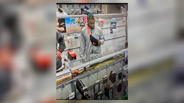 Police are still looking to identify the second suspect, who appears to have braids, a goatee and a tattoo of a rifle on his neck.