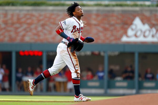 Ronald Acuna Jr.  jogs off the field after being caught stealing during the first inning. (Photo by Kevin C. Cox/Getty Images)