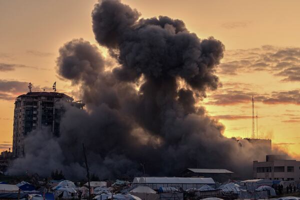 Smoke rises from a building after it was targeted by an Israeli army strike, following evacuation orders for residents, in Gaza City Saturday, March 22, 2025. (AP Photo/Jehad Alshrafi)