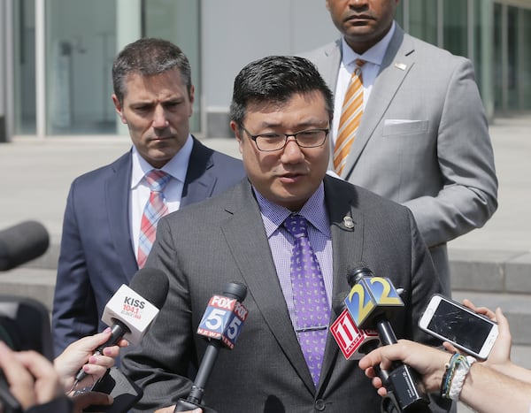 U.S. Attorney Byung J. “BJay” Pak, center, addresses the media earlier this month after former Kasim Reed aide Katrina Taylor-Parks became the second high-ranking Atlanta official to plead guilty in the federal corruption investigation of City Hall. BOB ANDRES /BANDRES@AJC.COM