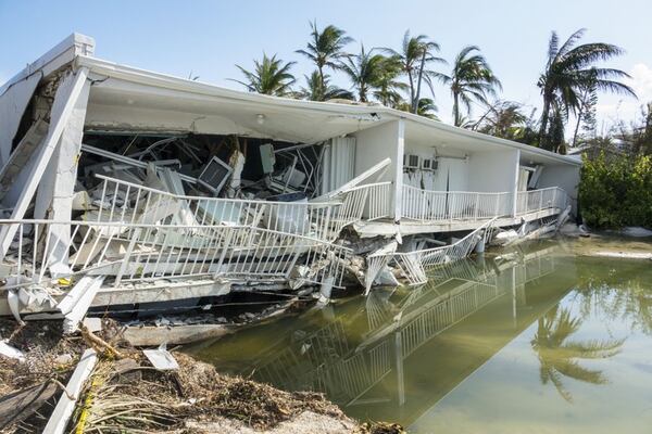 A 3-story building on Islamorada — 12 units in 2 stories with a parking garage underneath — is collapsed into itself after Hurricane Irma Tuesday, Sept. 12, 2017. The storm surge passed over the area and apparently caused the building to collapse.