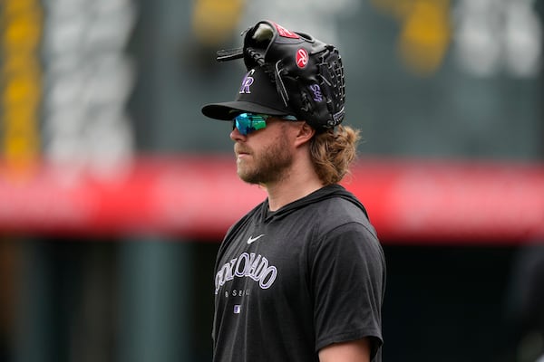 Colorado Rockies relief pitcher Pierce Johnson (36) warms up before a baseball game against the Philadelphia Phillies Friday, May 12, 2023, in Denver. (AP Photo/David Zalubowski)