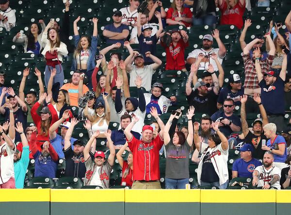 Atlanta Braves and Chicago Cubs fans get the wave going during the 8th inning at Truist Park in a MLB baseball game on Monday.  Curtis Compton / Curtis.Compton@ajc.com