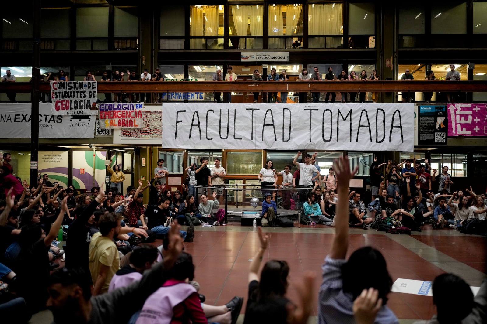 Students gather at the University of Buenos Aires to brainstorm ways to protest President Javier Milei's veto of a law to increase funding for public universities in Buenos Aires, Argentina, Wednesday, Oct. 16, 2024. (AP Photo/Natacha Pisarenko)