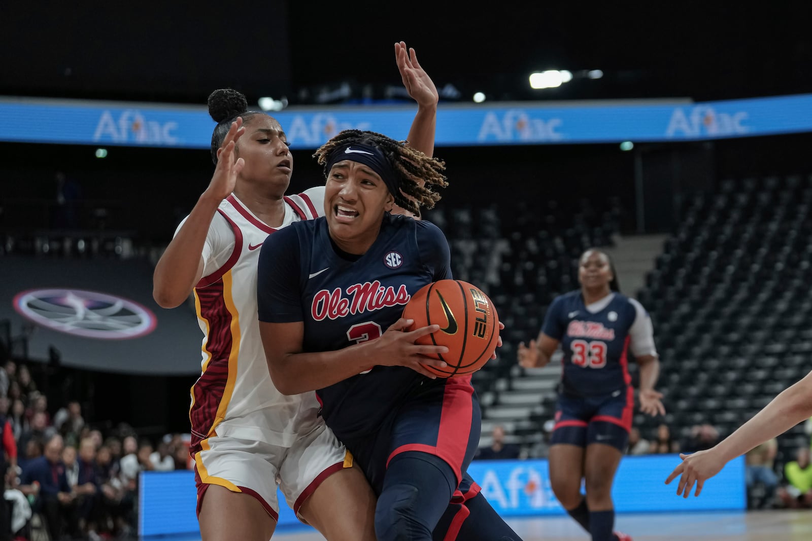 Mississippi guard Kennedy Todd-Williams drives against USC guard Juju Watkins during an NCAA college basketball game in Paris, France Monday, Nov. 4, 2024. (AP Photo/Aurelien Morissard)