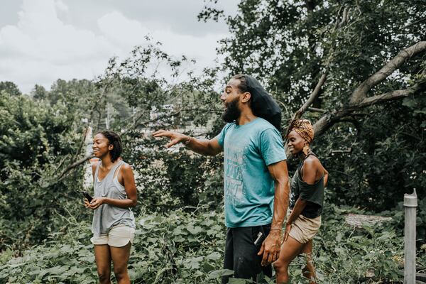 Reynaldo Holmes (foreground) of Soul Spirit Farmers teaches his neighbors how to farm in East Point. CONTRIBUTED BY CALEB JONES