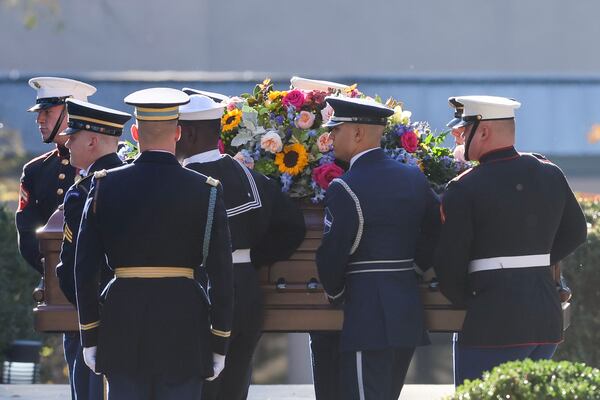 Former first lady Rosalynn Carter's casket arrives at the Carter Presidential Center in Atlanta. (Jason Getz / Jason.Getz@ajc.com)