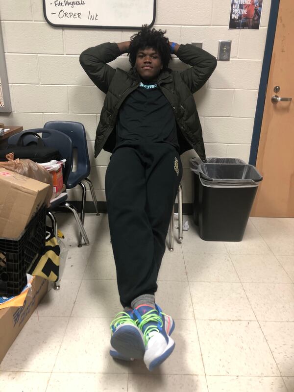 Broderick Jones relaxes in the football office at Lithonia High School. (Photo by Chip Towers)