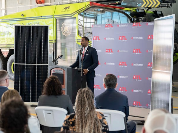 Atlanta Mayor Andre Dickens speaks Tuesday, Jan. 7, at the unveiling of newly operational solar panels on the roof of Fire Station No. 40 at Hartsfield-Jackson International Airport in Atlanta. Daniel Varnado/For the AJC
