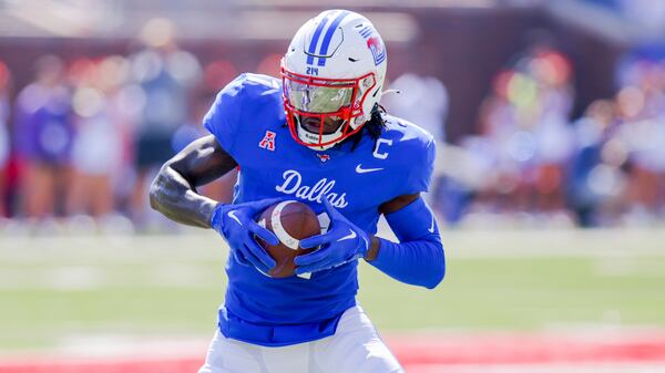 SMU wide receiver Rashee Rice looks to run after catching a pass during the first half of an NCAA college game against TCU on Saturday, Sept. 24, 2022, in Dallas, Texas. (AP Photo/Gareth Patterson)