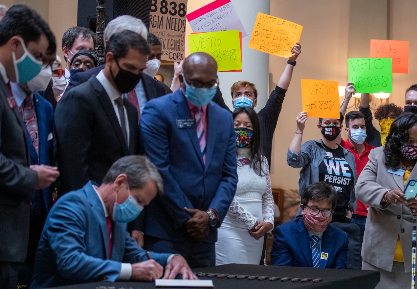 PHOTOS: Gov. Kemp signs hate-crimes bill on last day of legislative session