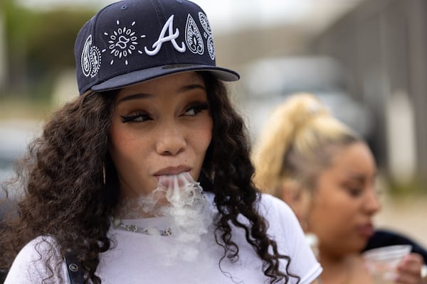 Atlanta rapper Anycia Edwards hangs out with friends before her performance at the SelectCon conference at Guardian Works in June 1. (Arvin Temkar / AJC)