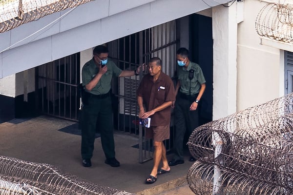 FILE- Jimmy Lai walks through the Stanley prison in Hong Kong, on July 28, 2023. (AP Photo/Louise Delmotte, File)