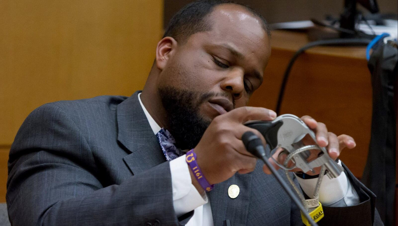 Investigator Brian Salters identifies one of the 4 .38 caliber handguns belonging to Tex McIver during Wednesday’s testimony. STEVE SCHAEFER / SPECIAL TO THE AJC