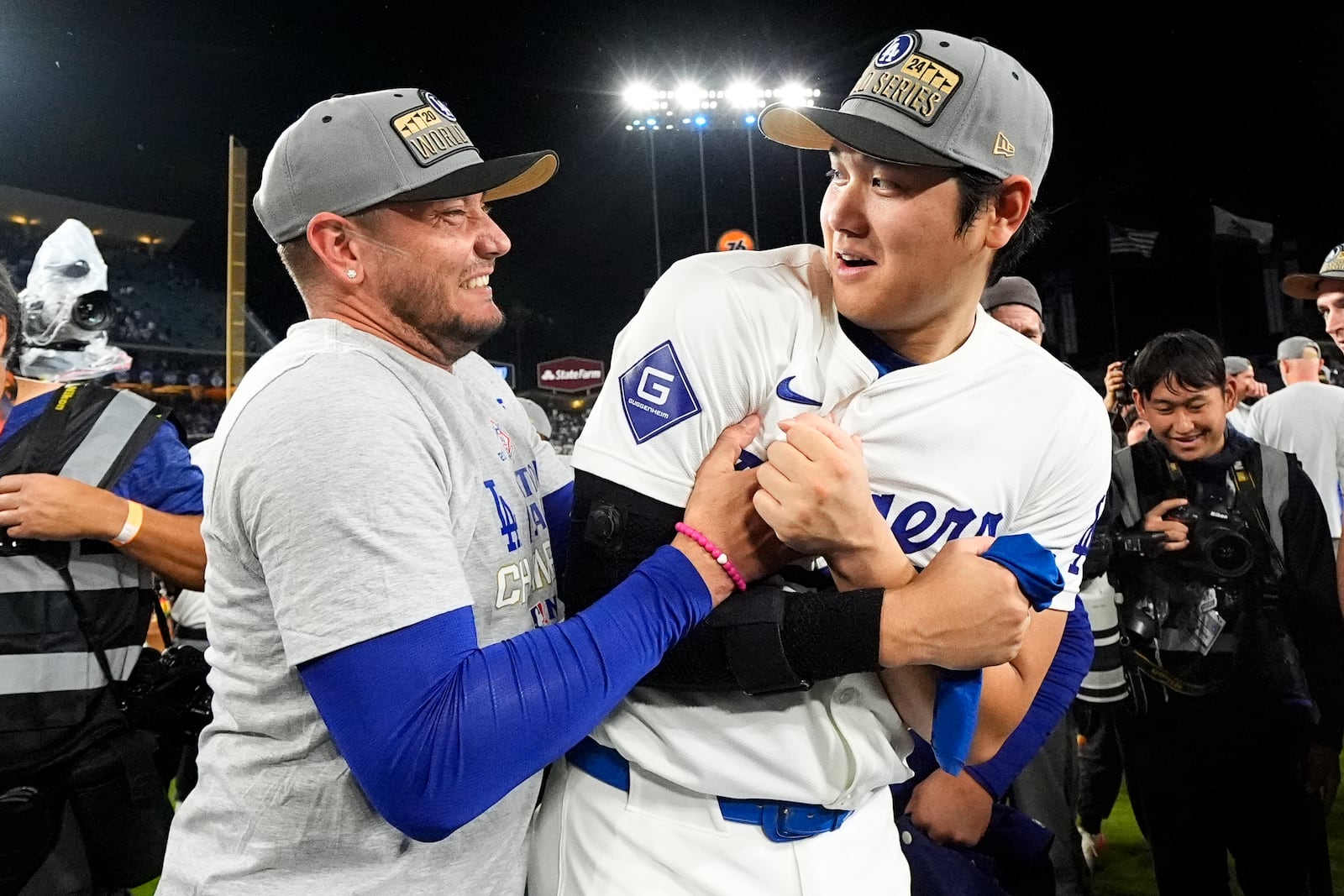 Los Angeles Dodgers' Shohei Ohtani celebrates their win against the New York Mets in Game 6 of a baseball NL Championship Series, Sunday, Oct. 20, 2024, in Los Angeles. The Dodgers will face the New York Yankees in the World Series. (AP Photo/Julio Cortez)