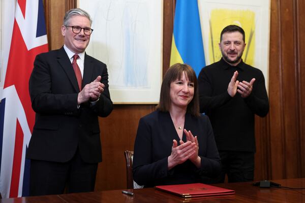 From left, British Prime Minister Keir Starmer, Britain's Chancellor of the Exchequer Rachel Reeves and Ukrainian President Volodymyr Zelenskiyy applaude during a video conference meeting with Ukraine's Finance Minister Sergii Marchenko in London, England, March 1, 2025. (Toby Melville/Pool Photo via AP)