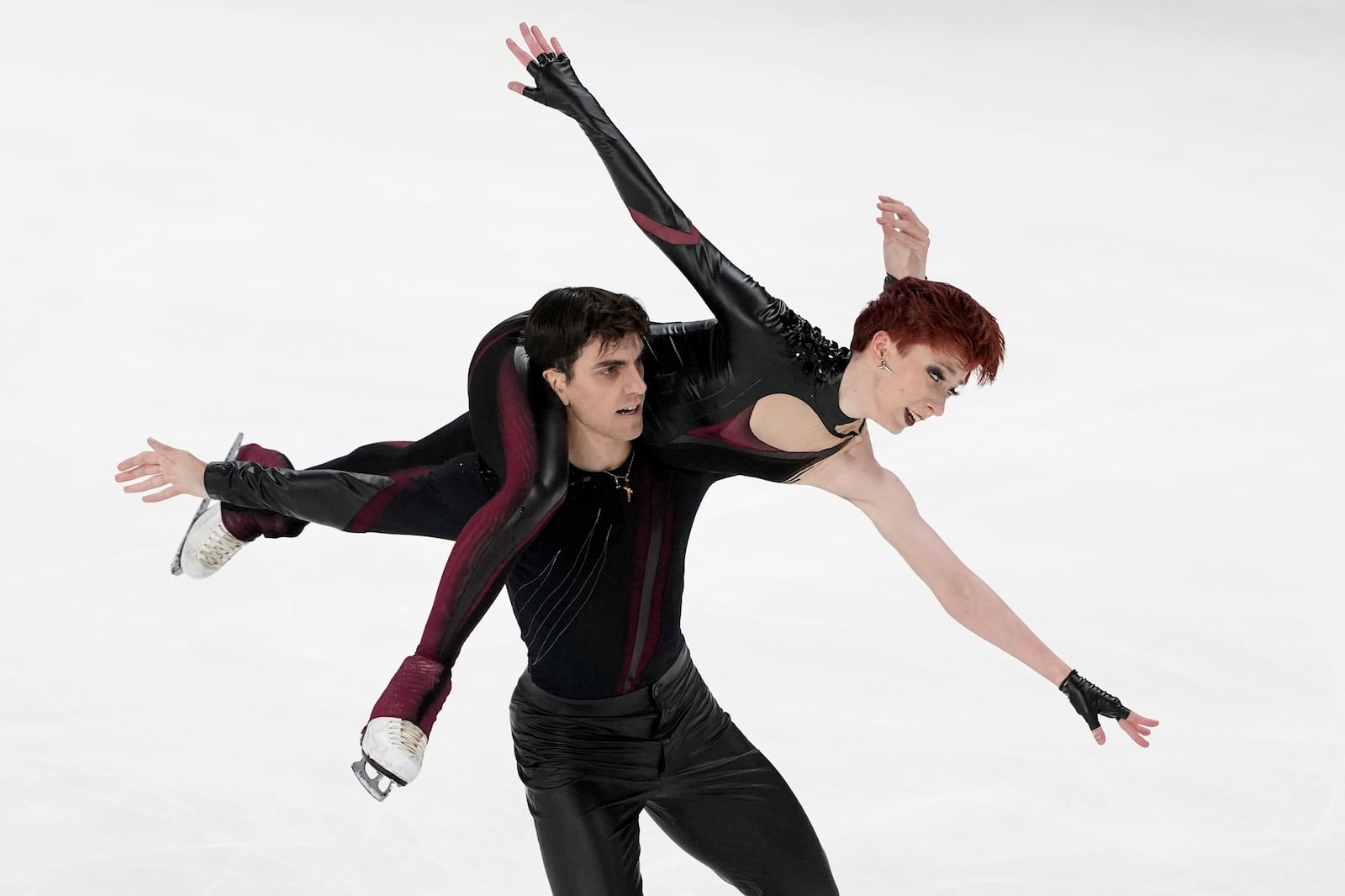 Evgeniia Lopareva and Geoffrey Brissaud, of France, compete in the ice dance's free dance segment at the ISU Grand Prix of Figure Skating, Saturday, Nov. 2, 2024, in Angers, France. (AP Photo/Aurelien Morissard)