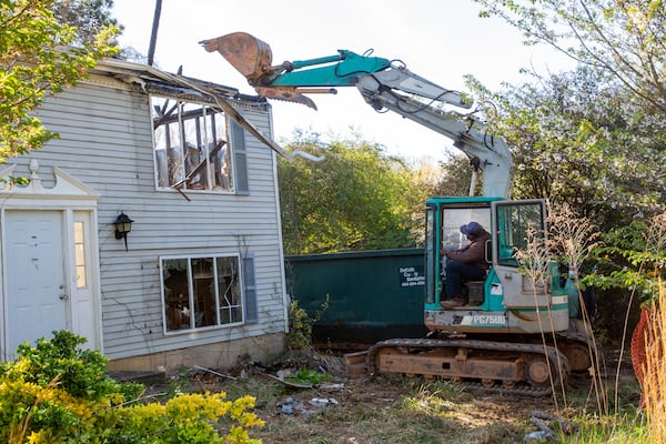 DeKalb County officials demolish a home as part of their efforts to address blight in Stone Mountain Friday, April 1, 2022. STEVE SCHAEFER FOR THE ATLANTA JOURNAL-CONSTITUTION