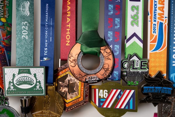 Caroline Burnet’s running medals are seen at her home in Atlanta on Friday, February 28, 2025. Burnet will be running her 200th marathon. (Arvin Temkar / AJC)