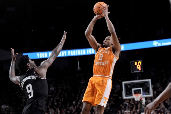 Tennessee guard Chaz Lanier (2) makes a basket over Texas A&M forward Solomon Washington (9) during the second half of an NCAA college basketball game Saturday, Feb. 22, 2025, in College Station, Texas. (AP Photo/Sam Craft)