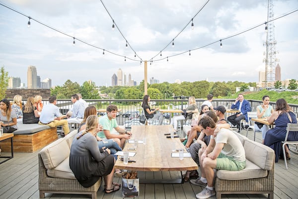 The rooftop at O-Ku faces east toward the Midtown skyline, where skyscrapers catch and reflect the colors of the sunset. CONTRIBUTED BY HEIDI GELDHAUSER