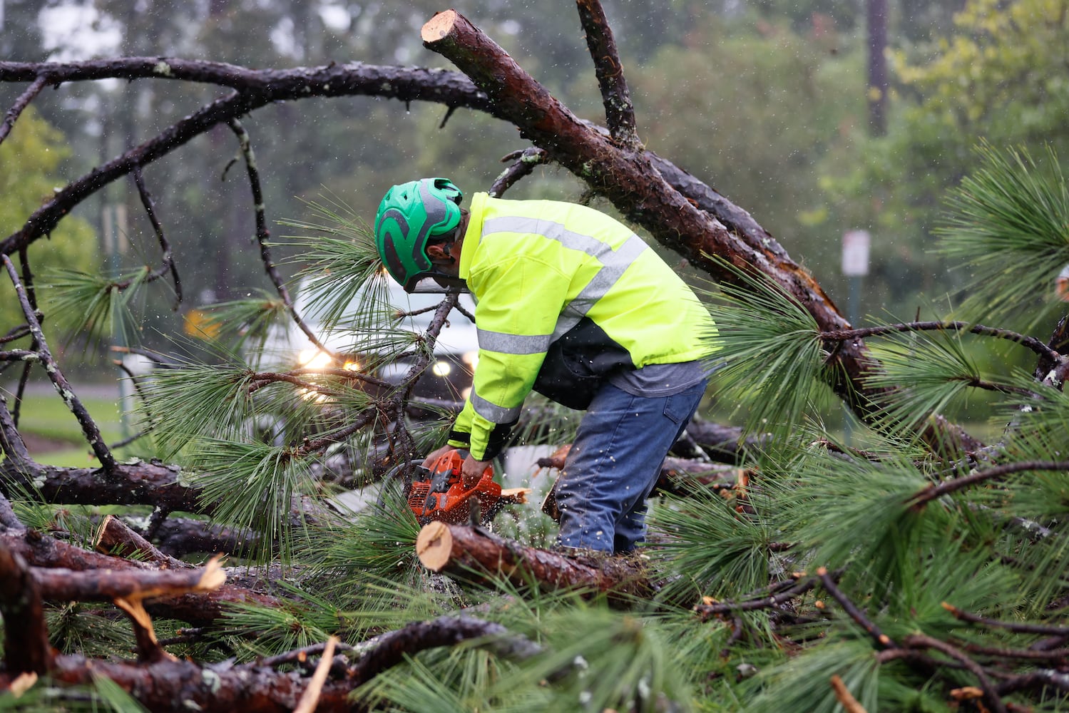 Clean-up crews are working to clear storm debris, including pine trees, in a neighborhood on the north side of Valdosta amid Tropical Storm Debby on Monday, August 5, 2024.
(Miguel Martinez / AJC)