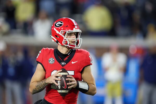 Georgia quarterback Carson Beck (15) looks to pass during the fourth quarter against the Georgia Tech at Bobby Dodd Stadium, Saturday, November 25, 2023, in Atlanta. Georgia plays Alabama on Saturday. (Jason Getz/Jason.Getz@ajc.com)