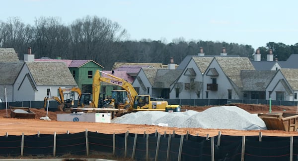 While many small towns in Georgia lost population, cities in the Atlanta metro area have swelled. Fayetteville now has 17,827 residents, according to new Census Bureau estimates. Population gains have spurred construction, such as this mixed-use development across the street from Pinewood Studios. EMILY HANEY / emily.haney@ajc.com