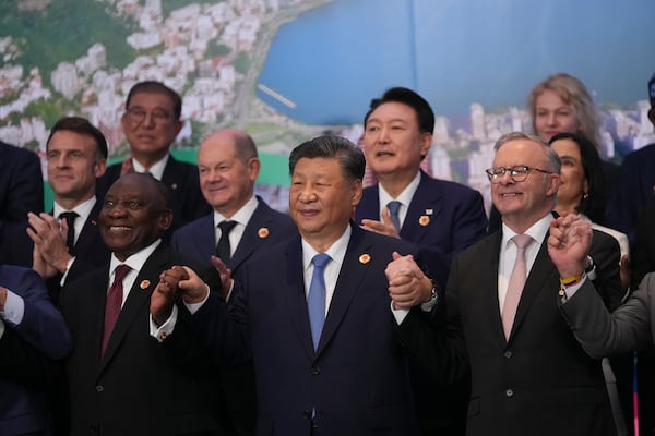 World leaders attending the G20 Summit pose for a group photo in Rio de Janeiro, Tuesday, Nov. 19, 2024. (AP Photo/Silvia Izquierdo)