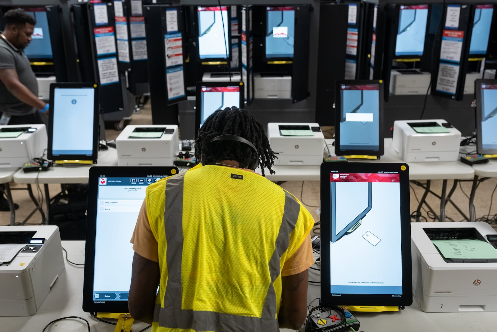 Dekalb County election officals conduct logic and accuracy testing of Dominion Voting System machines in September. (Ben Hendren for the AJC)