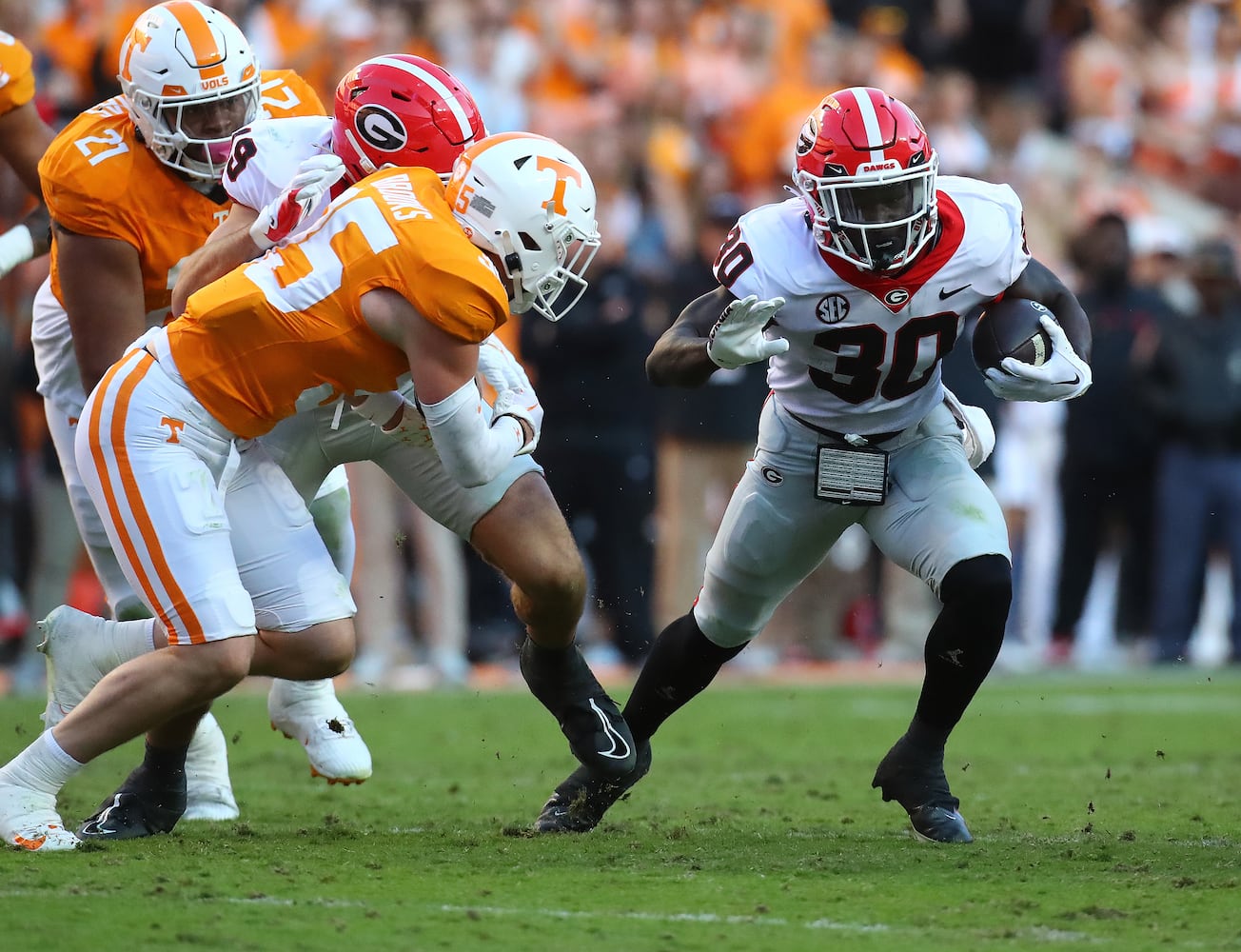 Georgia running back Daijun Edwards picks up yardage against Tennessee during the first half in a NCAA college football game on Saturday, Nov. 18, 2023, in Knoxville.  Curtis Compton for the Atlanta Journal Constitution