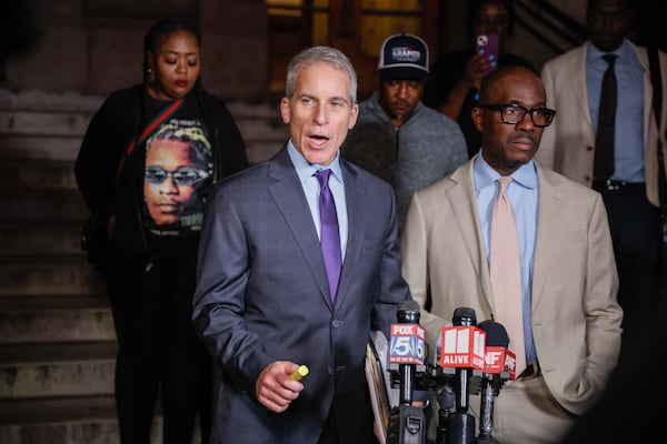 Defense attorneys Brian Steel and Keith Adams, speak to reporters after Atlanta rapper Young Thug was sentenced to time served and 15 years of probation in his Atlanta gang case. 
(Miguel Martinez / AJC)