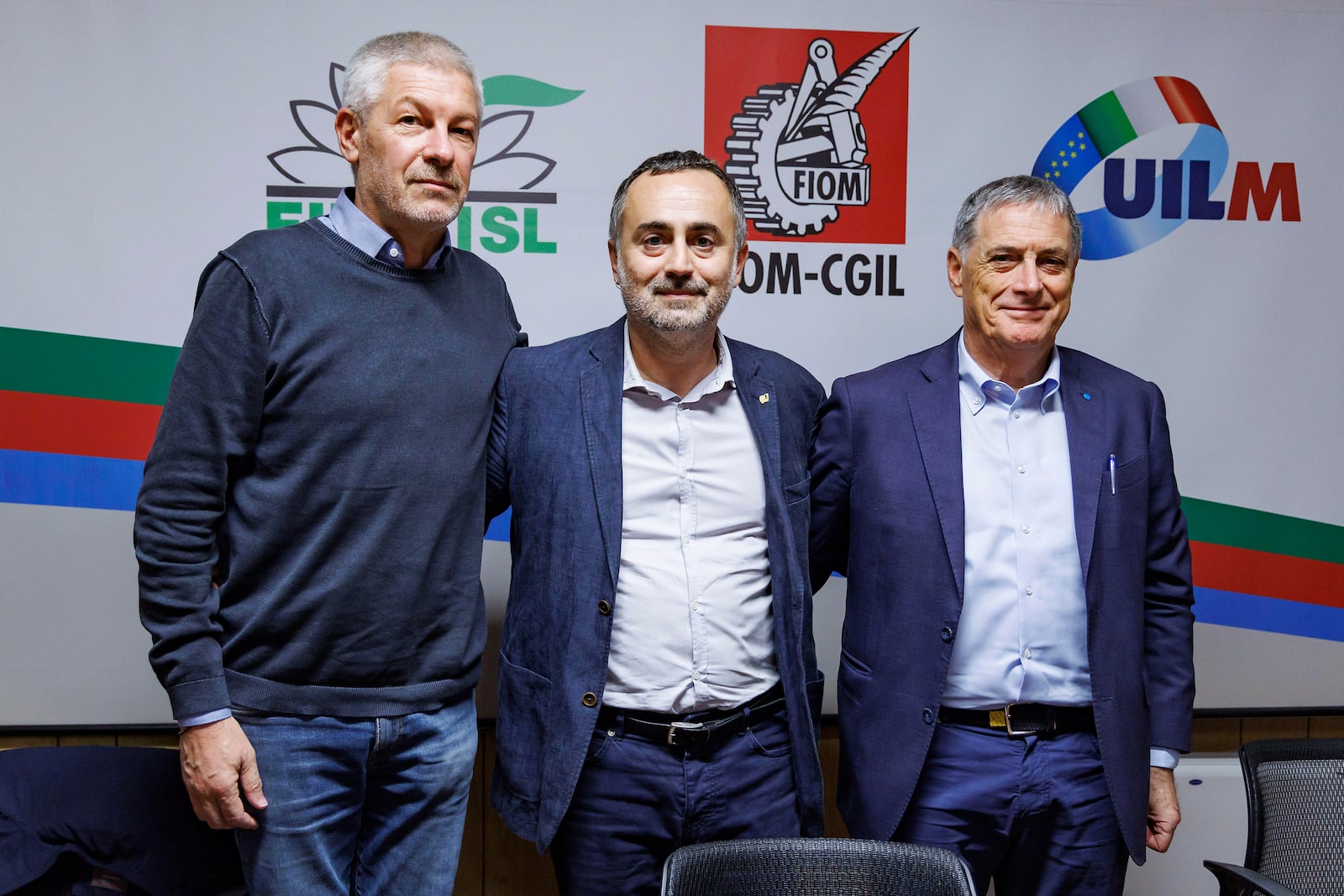 Fernando Uliano of Fim Cisl union, left, Michele De Palma of Fiom Cgil union, centre, and Rocco Palombella of Uilm union pose after announcing the mobilization of Stellantis workers and the entire automotive supply chain, in Rome, Tuesday, Sept. 24, 2024. (Roberto Monaldo/LaPresse via AP)