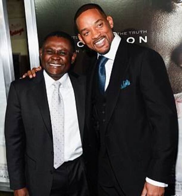 Dr. Bennet Omalu and Will Smith at the L.A. premiere of "Concussion."