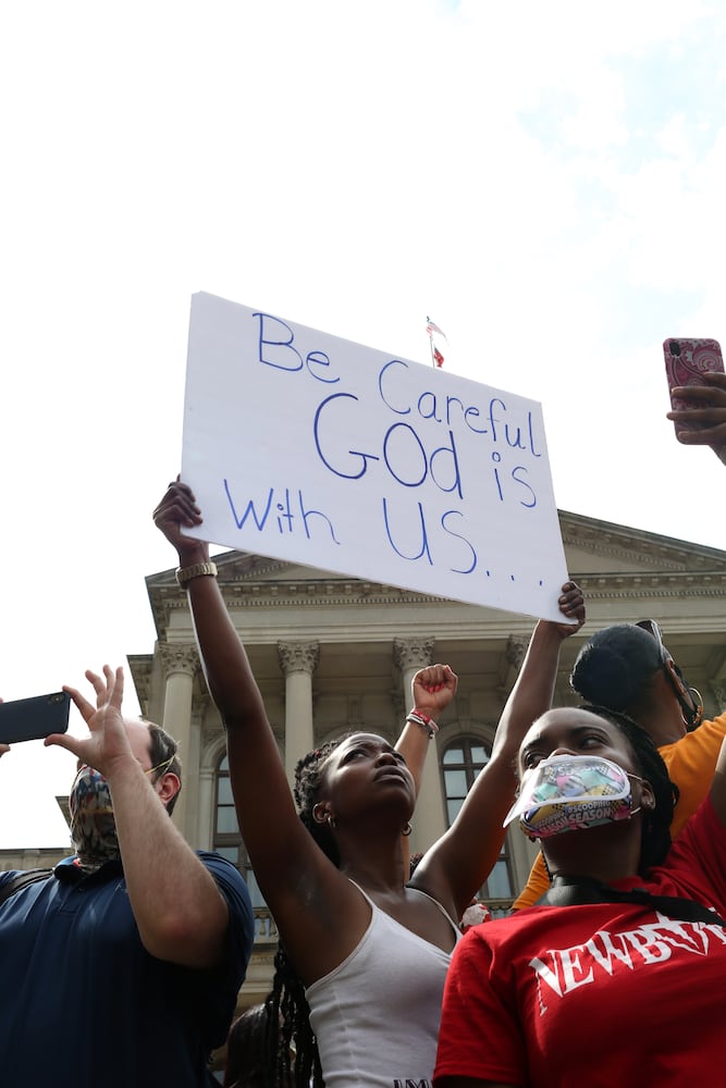 PHOTOS: Thousands march at Georgia Capitol as lawmakers return