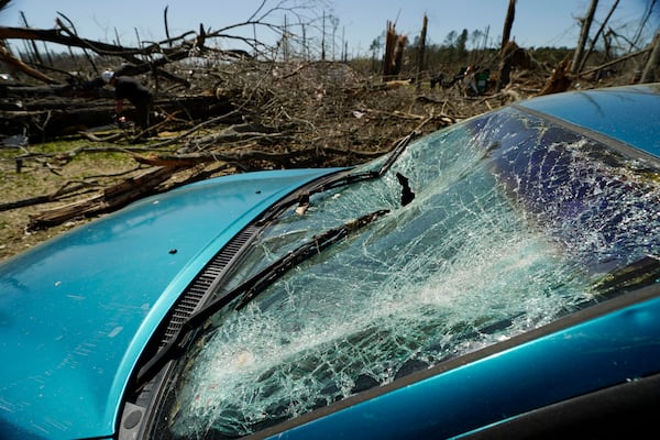 Steve Romero's vehicle's windshield displays the damage from Saturday's tornado, in Tylertown, Miss., on Sunday, March 16, 2024. (AP Photo/Rogelio V. Solis)